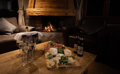 Canapes and drinks around roaring fire in Morzine ski chalet