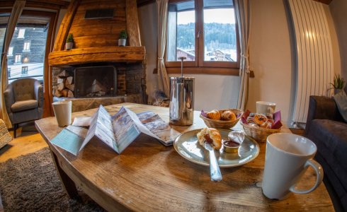 Piste Maps and Coffee in Chalet Atlas